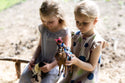 girl holding doll and horse