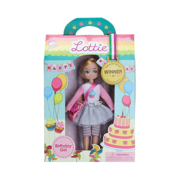 doll is dressed in a cupcake-print t-shirt, silver tutu, grey and pink leggings, silver trainers, and carries a sparkly deep pink bag. She also comes with 3 mini cards: an invitation, birthday, and thank you card.