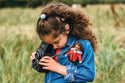 child holding a lottie doll