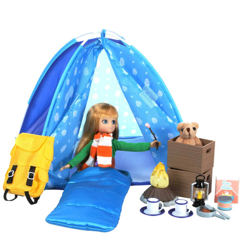 Lottie in sleeping bag. Blue camping tent with sleeping bag. Yellow backpack, teddy bear, 2 brown crates, pretend campfire, lantern, Box of Corn Flakes, 2 Tea cups with plates, frying pan and spatula