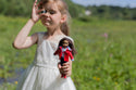 Child holding a lottie doll