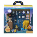 Blue camping tent with sleeping bag. Yellow backpack, teddy bear, 2 brown crates, pretend campfire, lantern, Box of Corn Flakes, 2 Tea cups with plates, frying pan and spatula