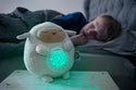 Child Sleeping next to the White Lamb with star and moon projection lights on tummy.