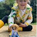 Lottie loves rainy days! Dressed in her raincoat and boots, she’s ready for muddy adventures in Branksea’s Daffodil Fields, splashing in puddles with her friends!