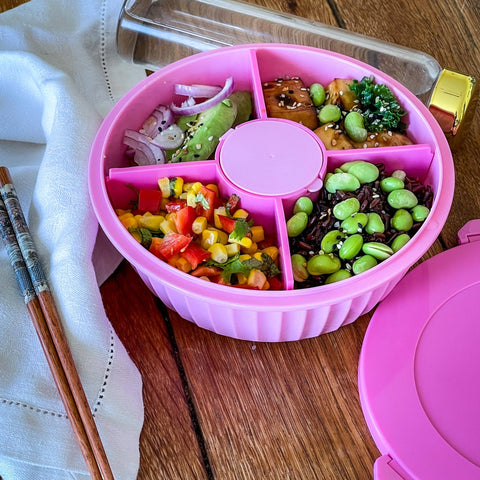 Pink 4 compartment bowl with a center compartment to hold dressing, sauce, and more