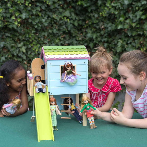 Girls playing with lottie dolls and Blue doll treehouse with porch, green slide, Swing, and rope ladder